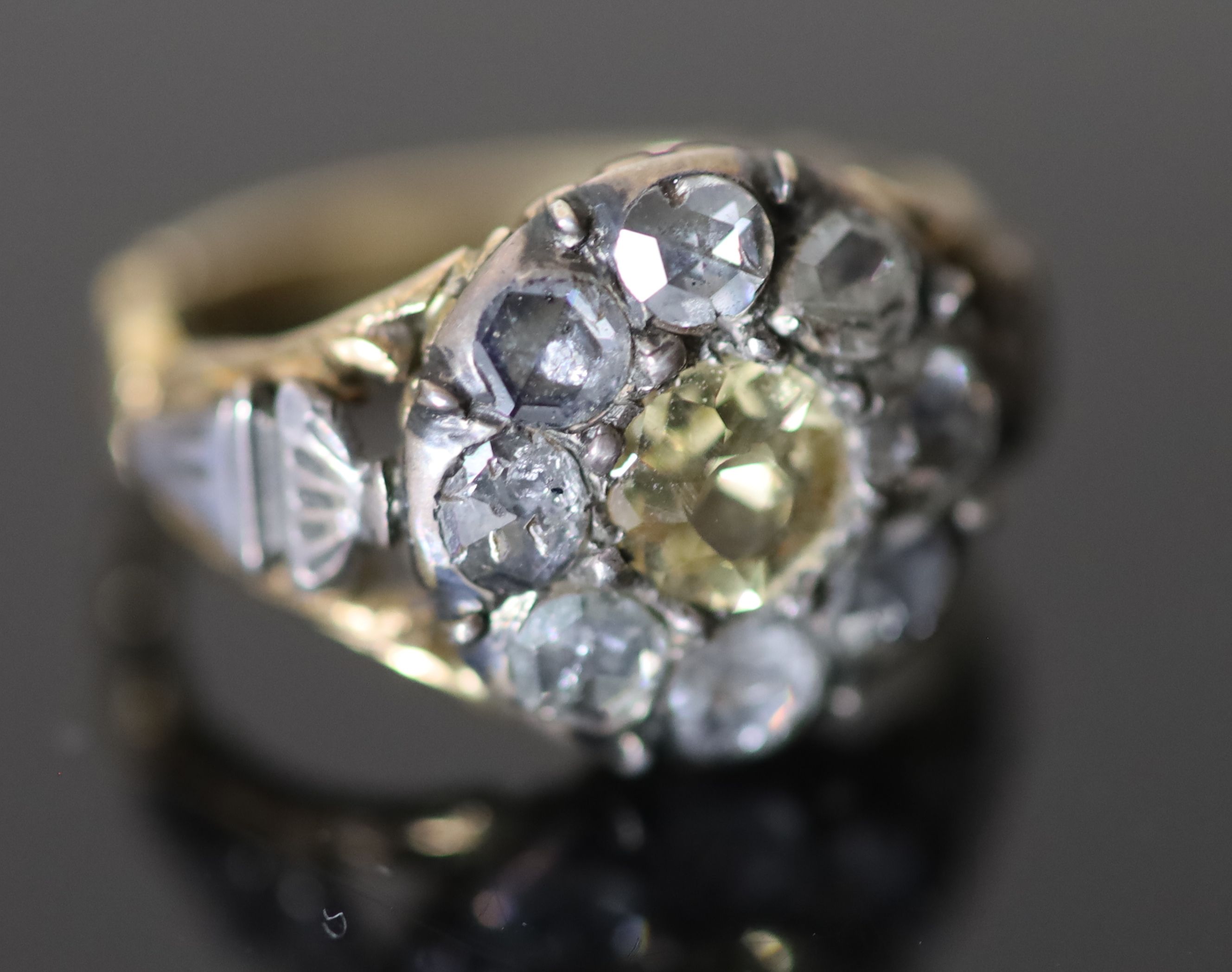 A George III gold and silver, single stone citrine and eight rose cut diamond cluster set dress ring,